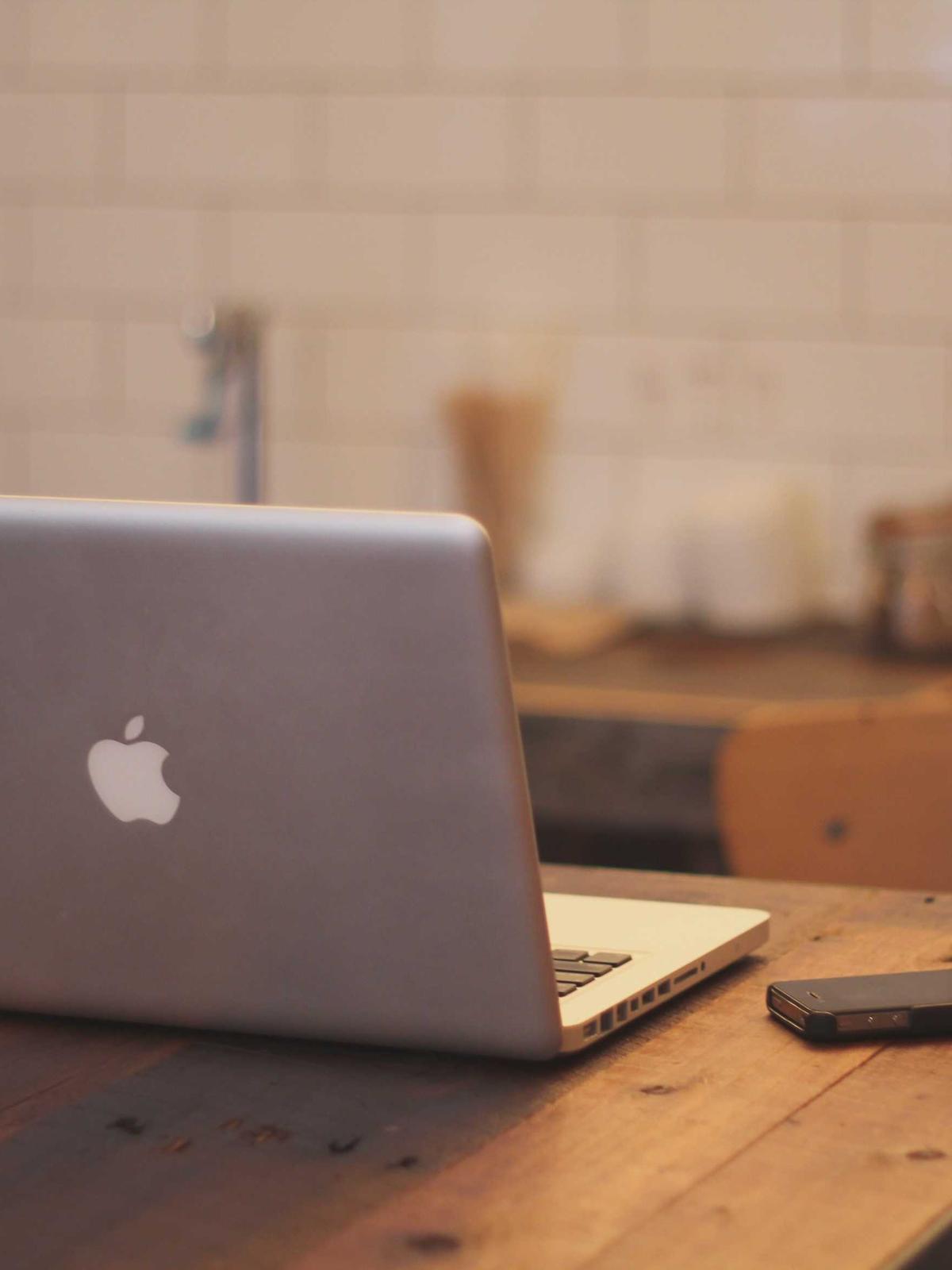 Developer workspace with laptop and notebook